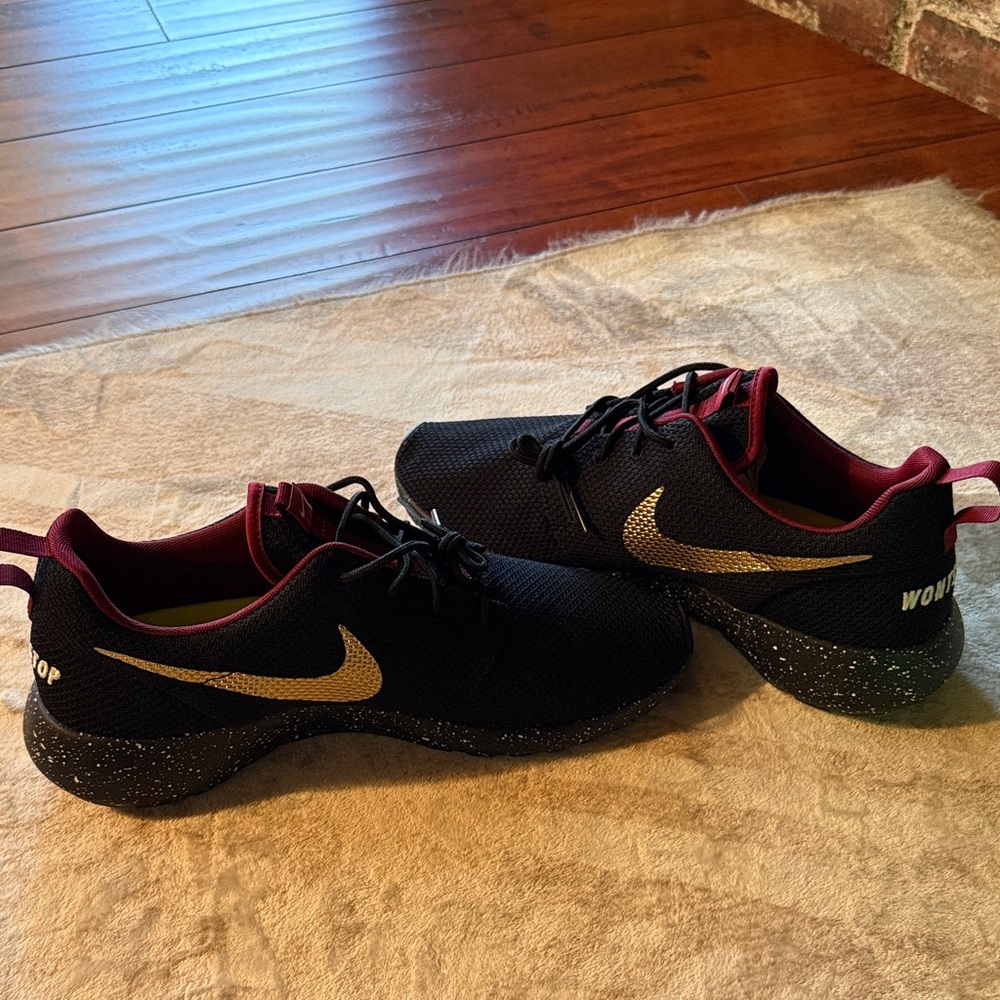 Nike Women’s Black Sneakers with Gold Swoosh and Maroon Accents